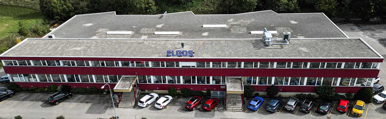 Photographie aérienne présentant les locaux de Cloos Electronic SA en Suisse, mettant en avant ses services EMS et ses capacités technologiques pour la réalisation circuit imprimé